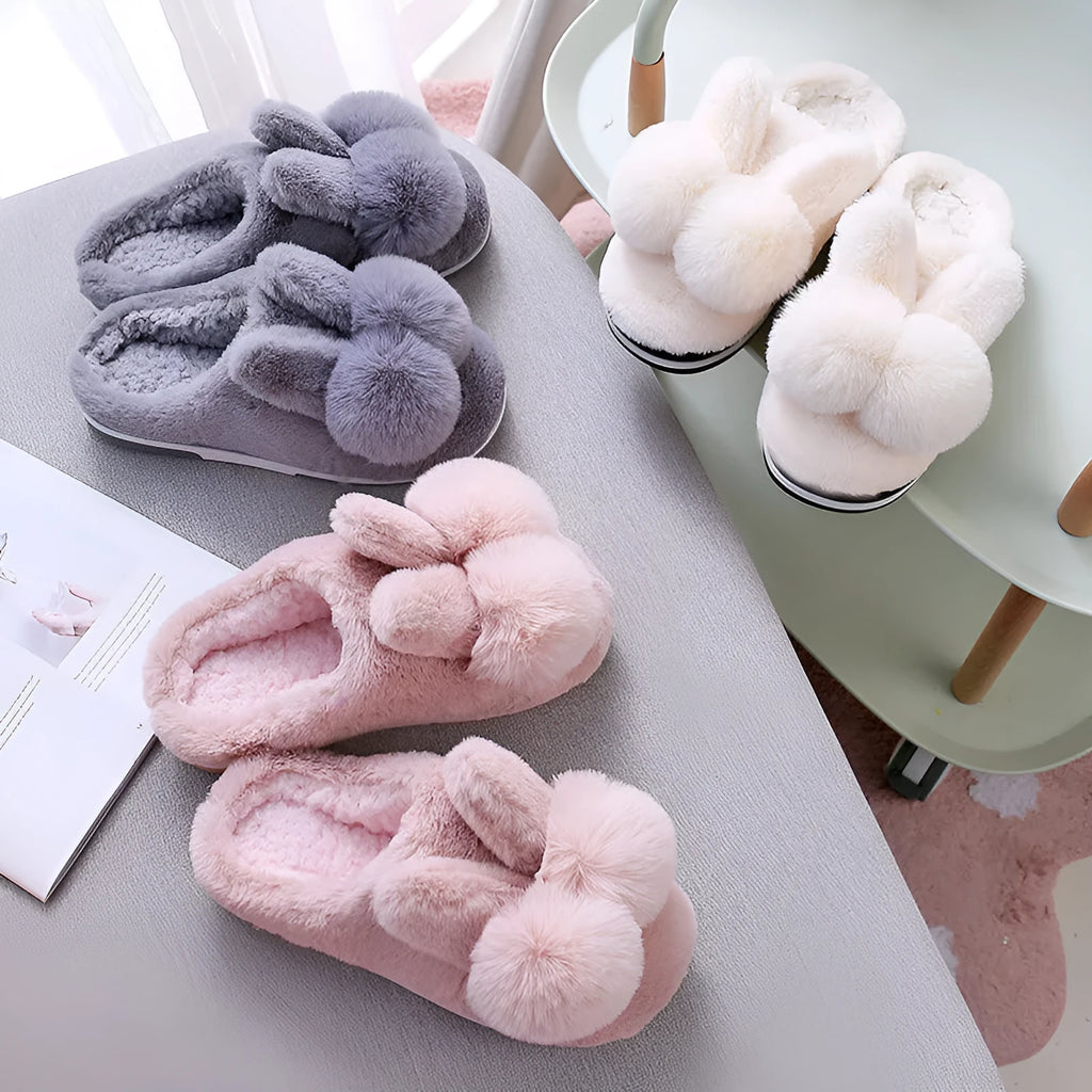 Women's fluffy pink rabbit fur winter slippers with a high overshoe design and sewn sole.