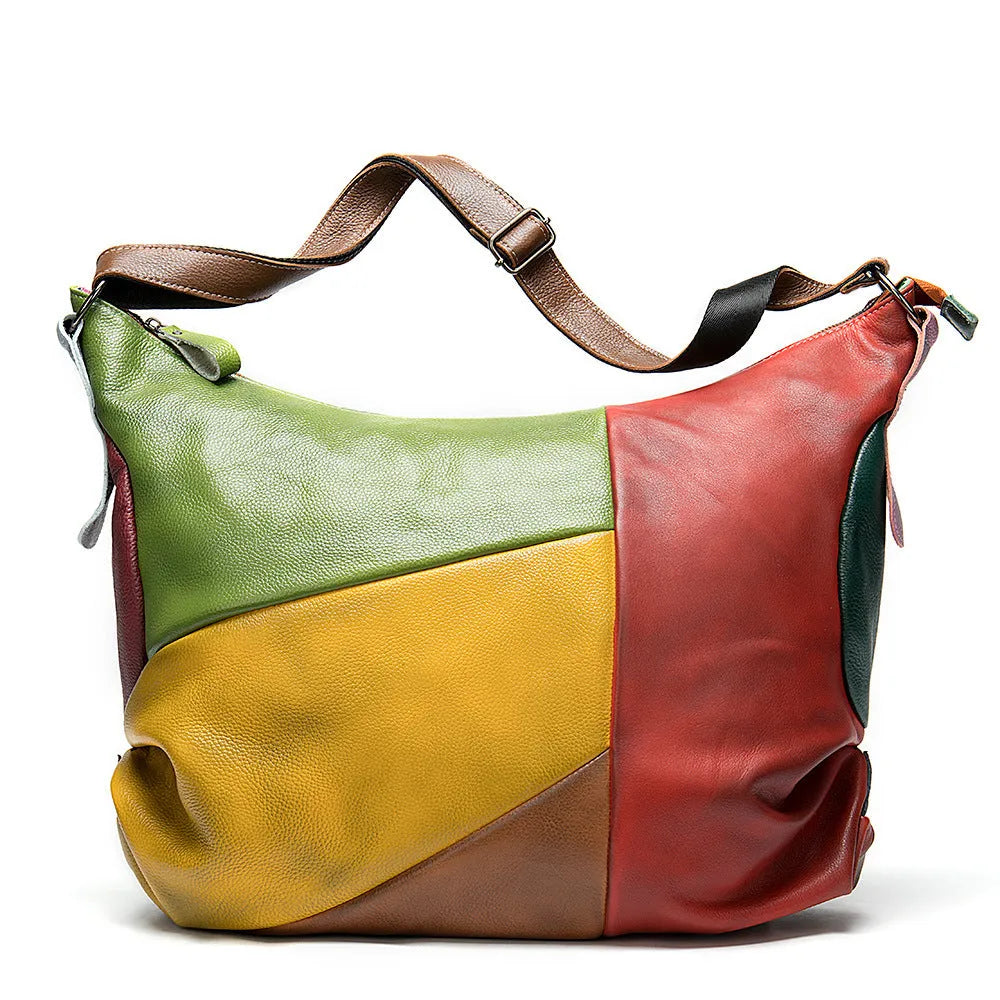 Brown cowhide leather stitching rubbing travel bag with crossbody strap.