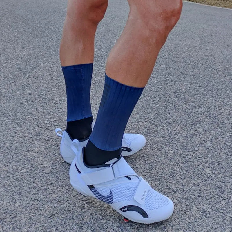 Cycling and running socks in orange colour with moisture-wicking athletic design