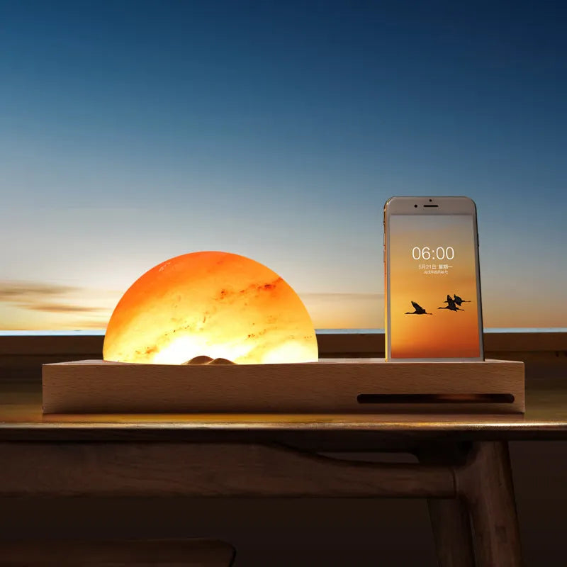 Sunrise Oriental wooden base salt lamp with wireless phone charging pad on top.
