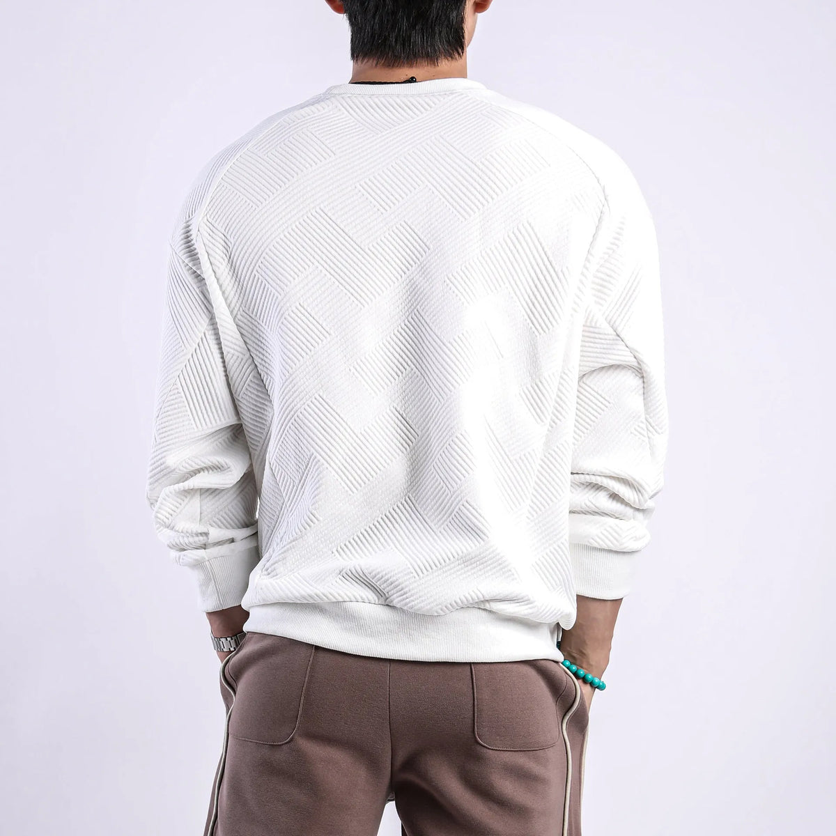 Men's loose fit twill jacquard long-sleeved sweater in Army Green colour showing round neck and regular sleeves