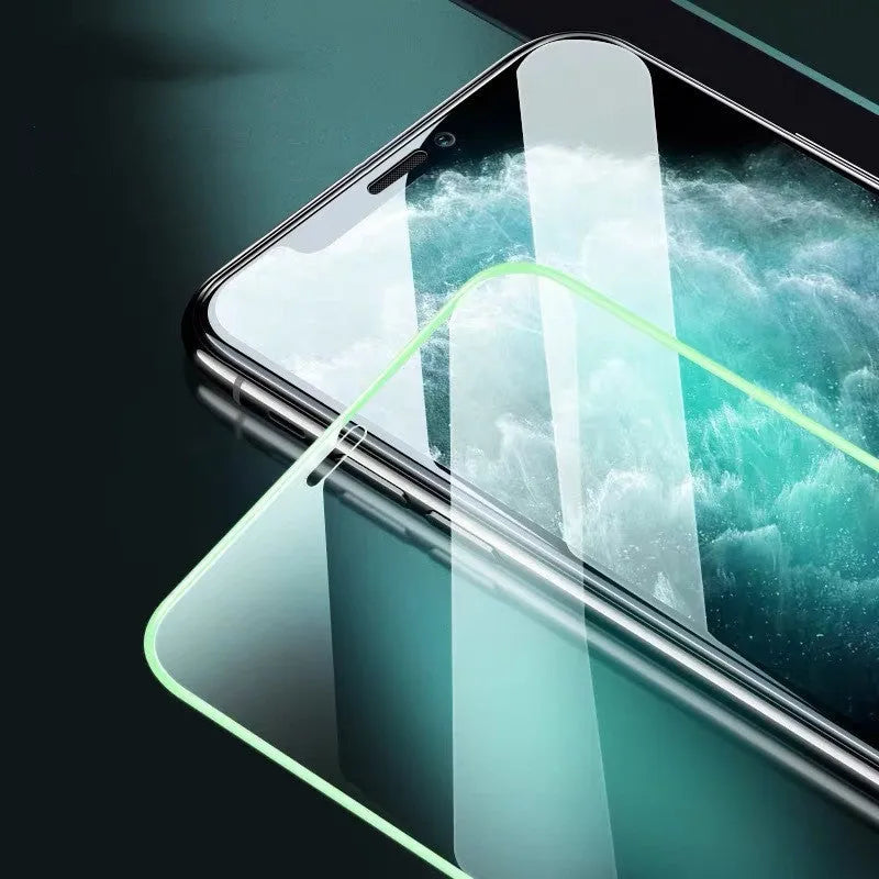 Luminous full cover tempered glass screen protector for iPhone glowing in the dark.