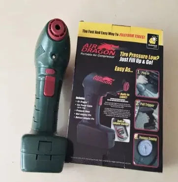 Black portable electric car air pump with motor and inflation hose for tyre pressure maintenance.