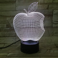 3D fruit-shaped decorative night light with colourful LED illumination on a table.