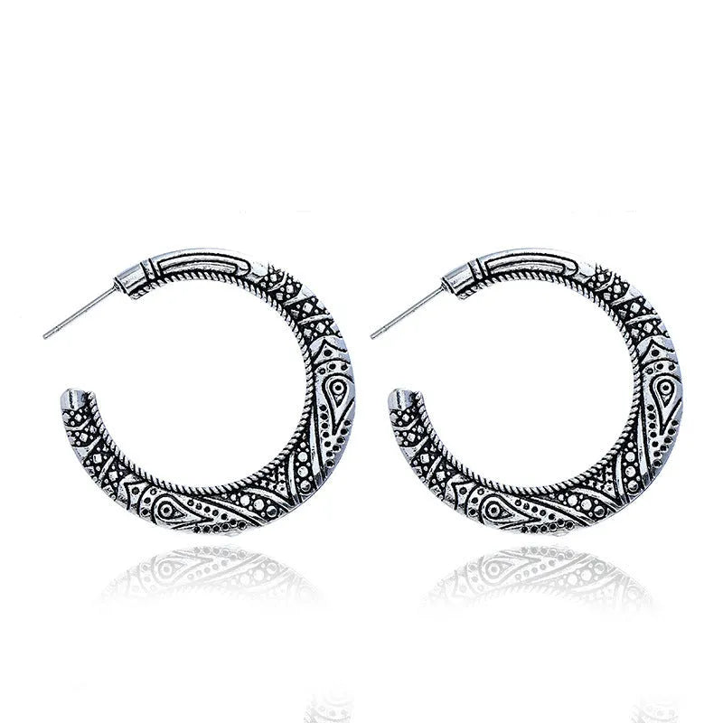 Vintage C-shaped alloy earrings with engraved detailing in bronze colour