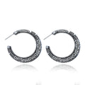Vintage C-shaped alloy earrings with engraved detailing in bronze colour