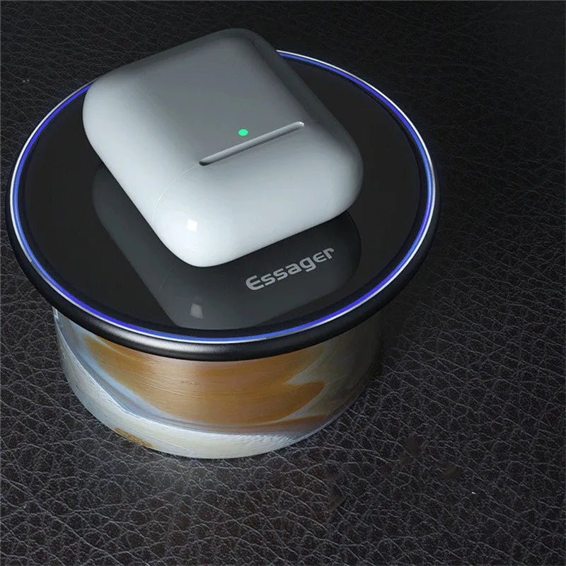 Black 15W Qi fast wireless charging pad with aluminium body and LED light, shown next to a smartphone.