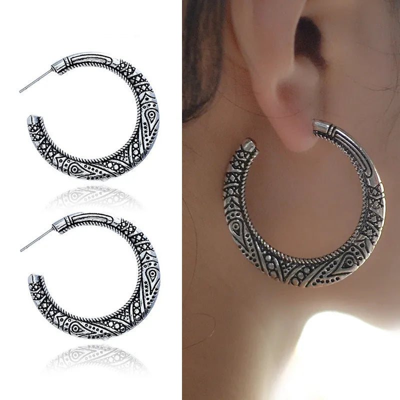 Vintage C-shaped alloy earrings with engraved detailing in bronze colour