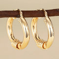 Golden geometric copper earring clip with ring and line design for women
