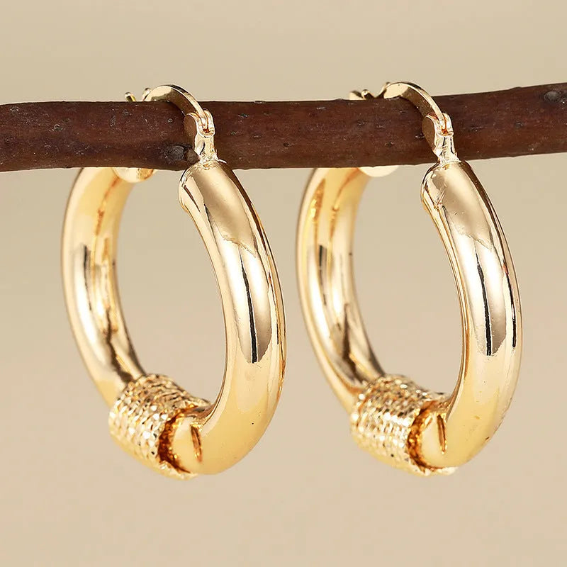 Golden geometric copper earring clip with ring and line design for women
