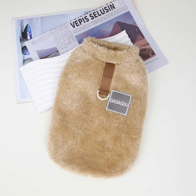 Fluffy blue coral fleece pet jacket with multi-coloured pull ring fastening on a dog model.