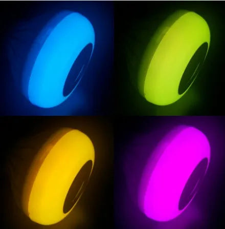 White Bluetooth smart light bulb with E27 base and remote control for 16 colour options and audio.