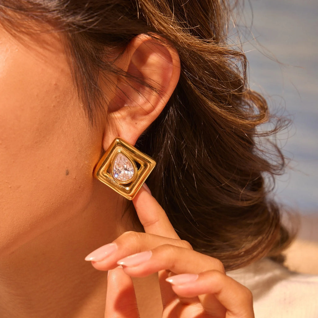 Gold geometric stud earrings with water drop zircon design on stainless steel