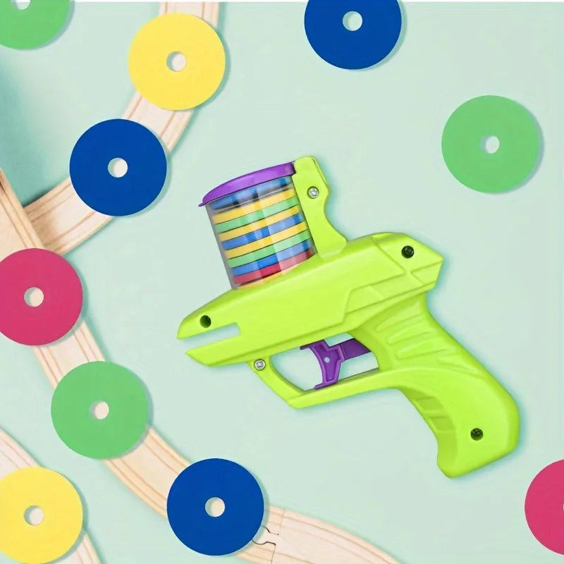 Green interactive cat toy launcher with three foam discs for battery-free feline play