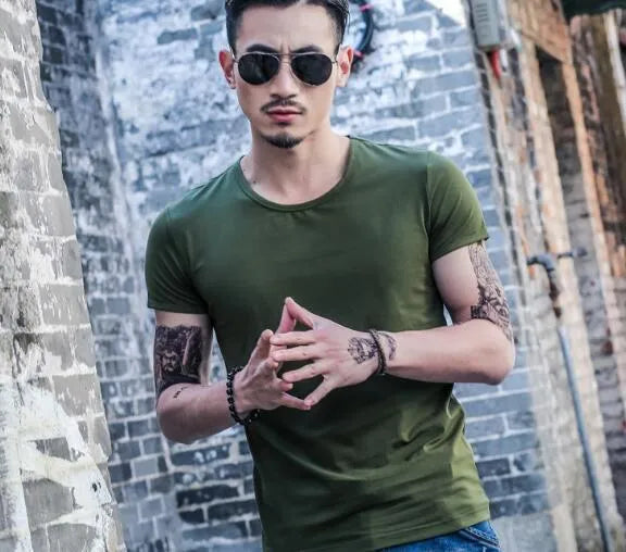 Man wearing a lightweight short sleeve summer T-shirt in a solid colour.