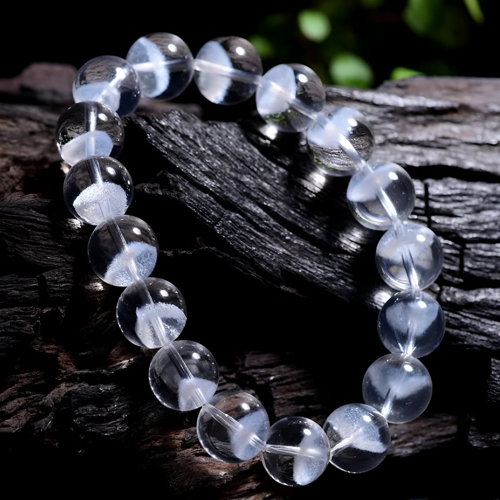 Women's white crystal ghost pyramid bracelet with Ruyi design elements on a wrist.