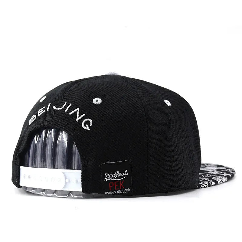 Cotton embroidered baseball cap with adjustable strap in black or white colours