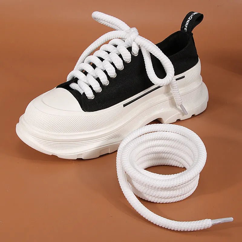 Round 10mm diameter woven shoelaces in white, beige and black colours showing thickness variations