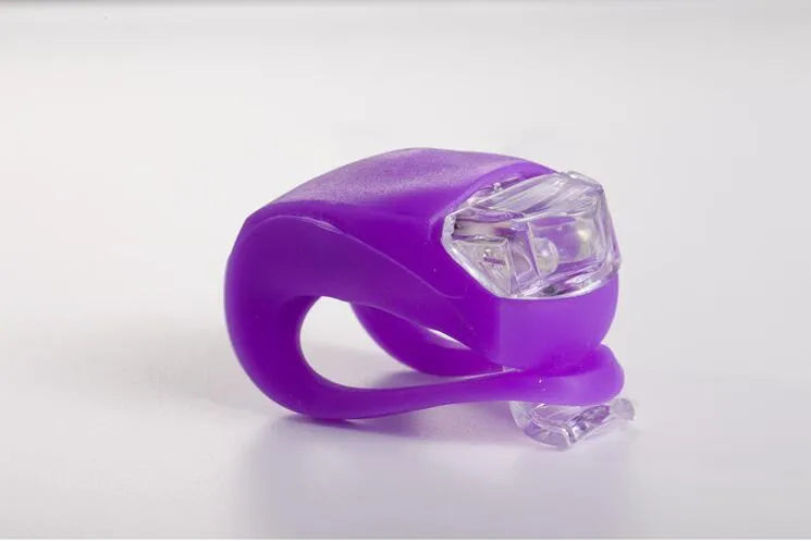 LED bike safety light with flexible silicone body, clip-on fitting and one-touch switch for cycling and nighttime use