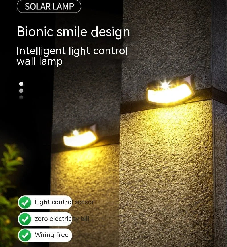 Solar outdoor wall lamp with smiling face design measuring 153mm by 76mm by 38mm