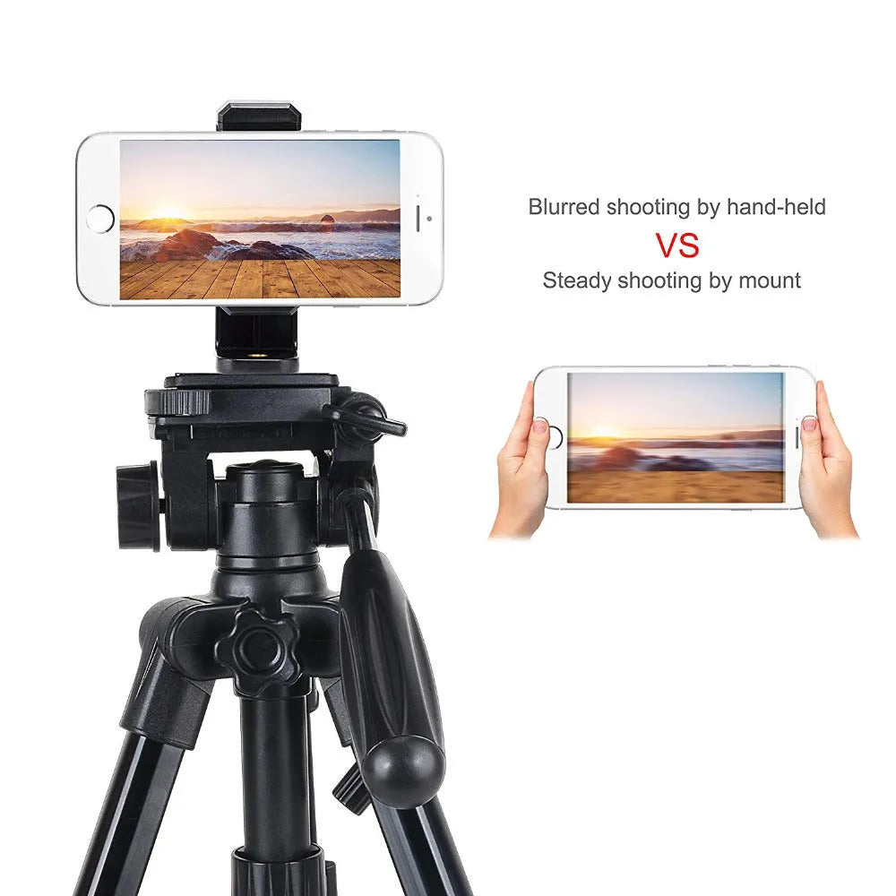 Black plastic mobile phone holder with rotating clamp on a desk
