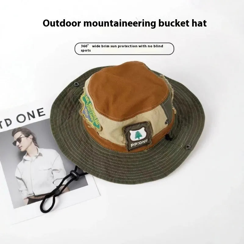 Army green cotton foldable fisherman hat with patchwork details and flat top crown