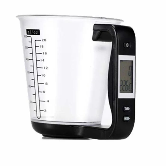 Green electronic digital measuring cup with LCD display on handle showing weight measurement.