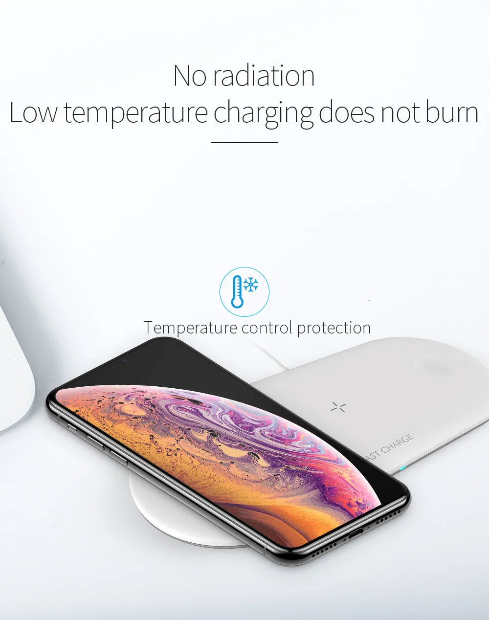 Black and white 3-in-1 wireless charging station for Apple-compatible phone, watch, and earbuds on a desk.