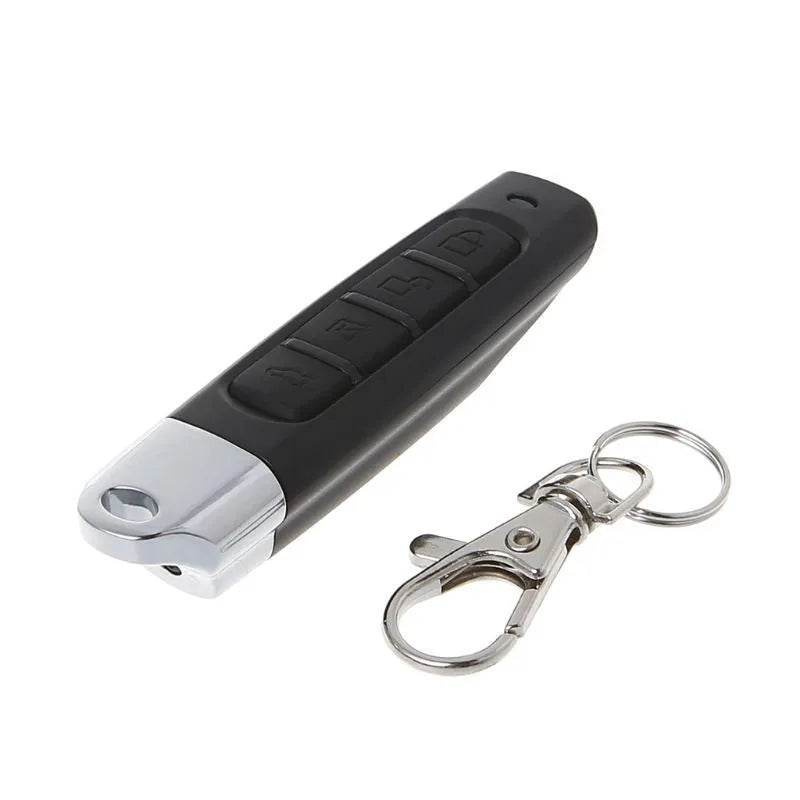 Rolling door remote control unit in choice of black, blue, grey, or red colours showing compact 6.7cm design