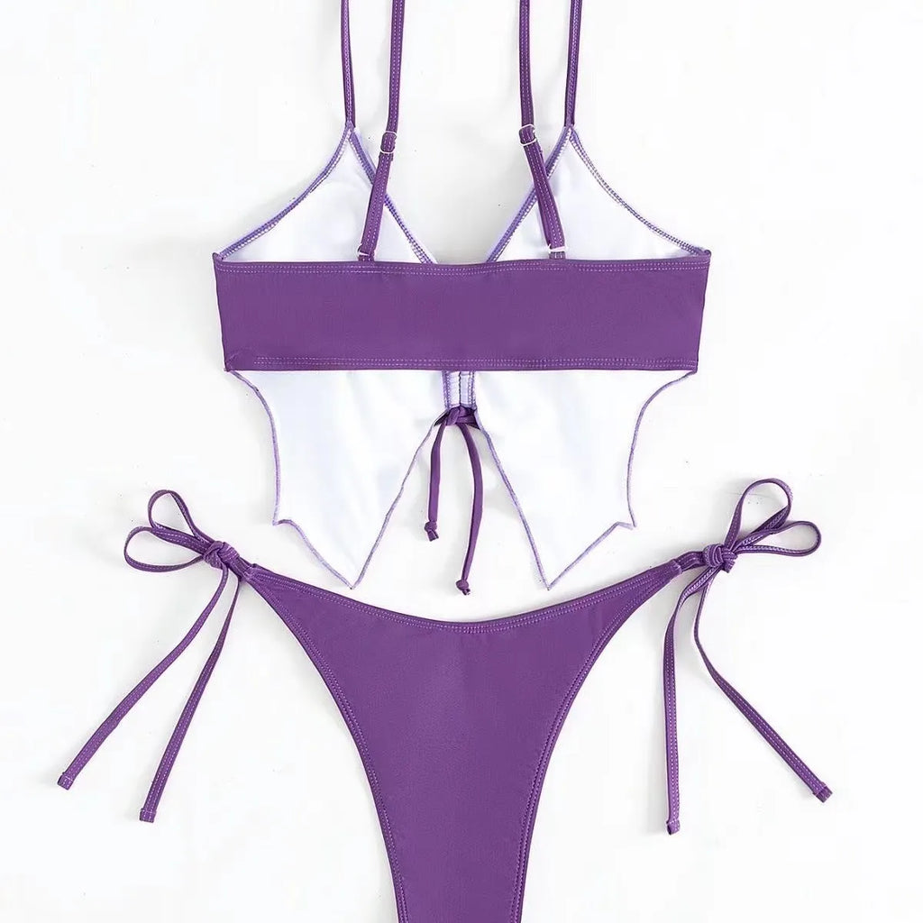 Women's purple bikini suit with bow detail and high-waisted briefs for swimming.