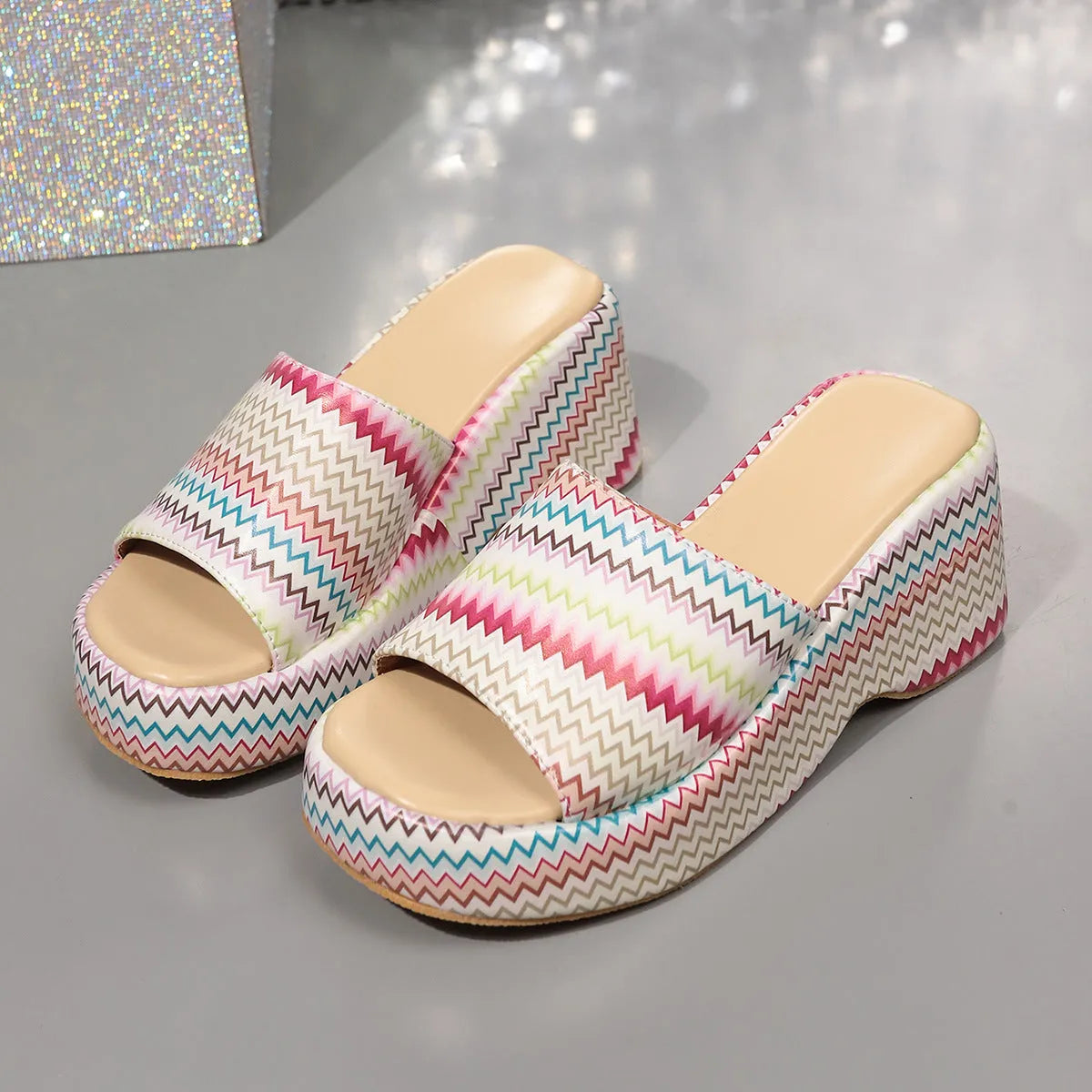 Colourful wave print wedge sandals for women with PU upper and thick rubber sole in beige, blue, or pink.