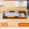 SK15 wired mechanical keyboard with central control knob in black, orange, or blue colour options