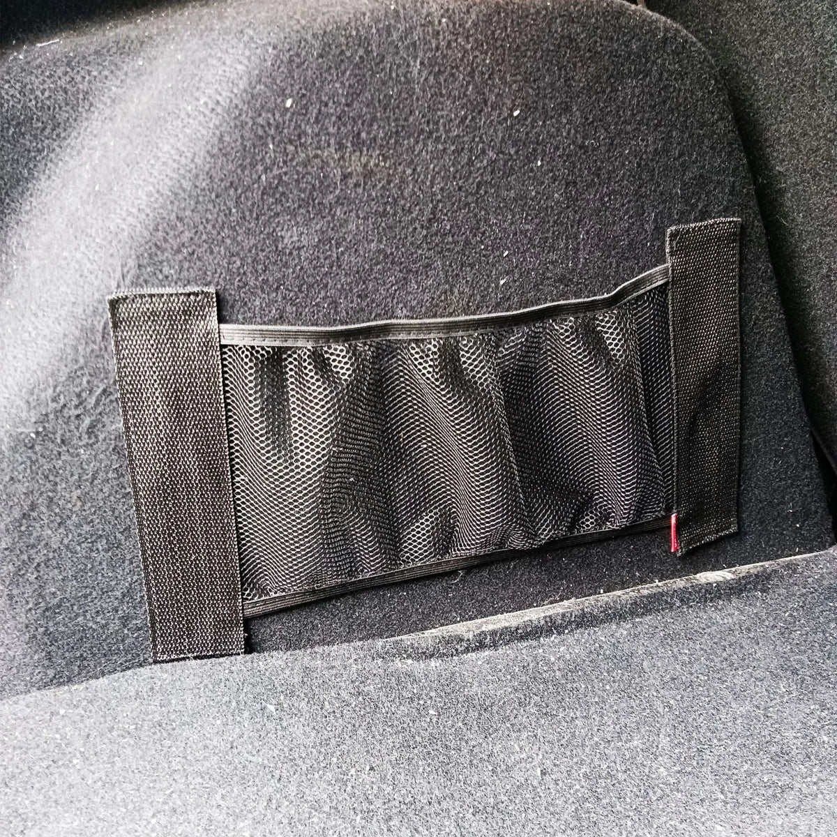 Elastic polyester storage net for securing items in a car boot, shown in 20x35cm and 20x45cm sizes.