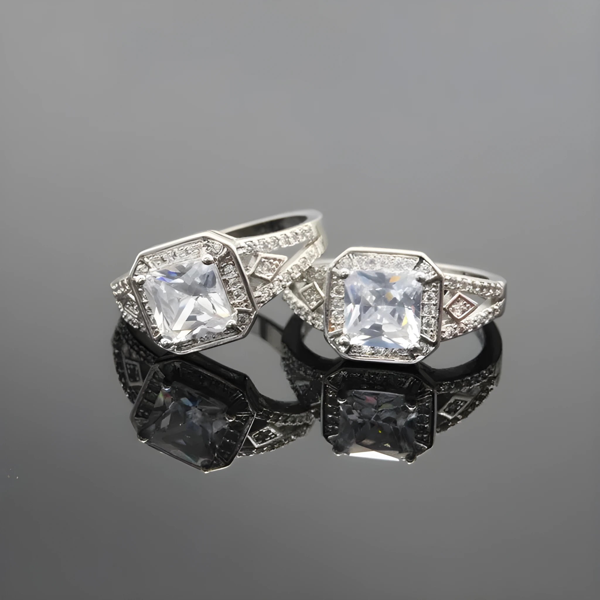 Geometric zircon ring with hollow design in platinum colour on copper, showing quadrilateral pattern and inlaid detailing
