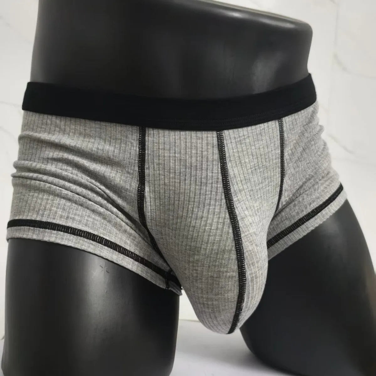 Men's solid colour breathable boxer shorts in white, black, grey, army green, and brown on a size chart.