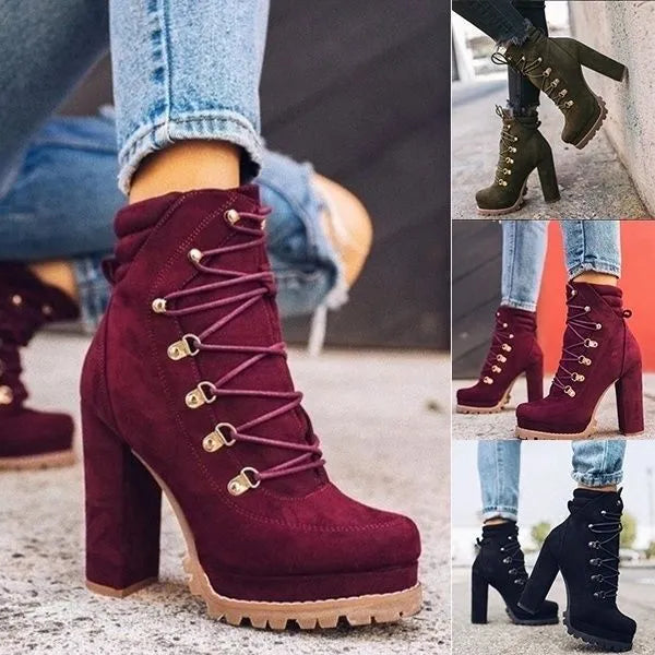 Women's army green suede high-heel boots with round toe, thick heel, belt buckle, and rivet details.