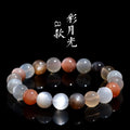 Natural colourful moonstone unisex bracelet with 8mm beads on a wrist.