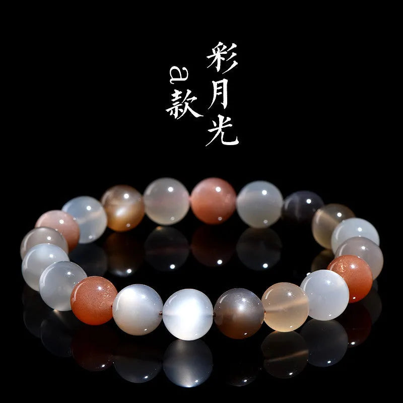 Natural colourful moonstone unisex bracelet with 8mm beads on a wrist.