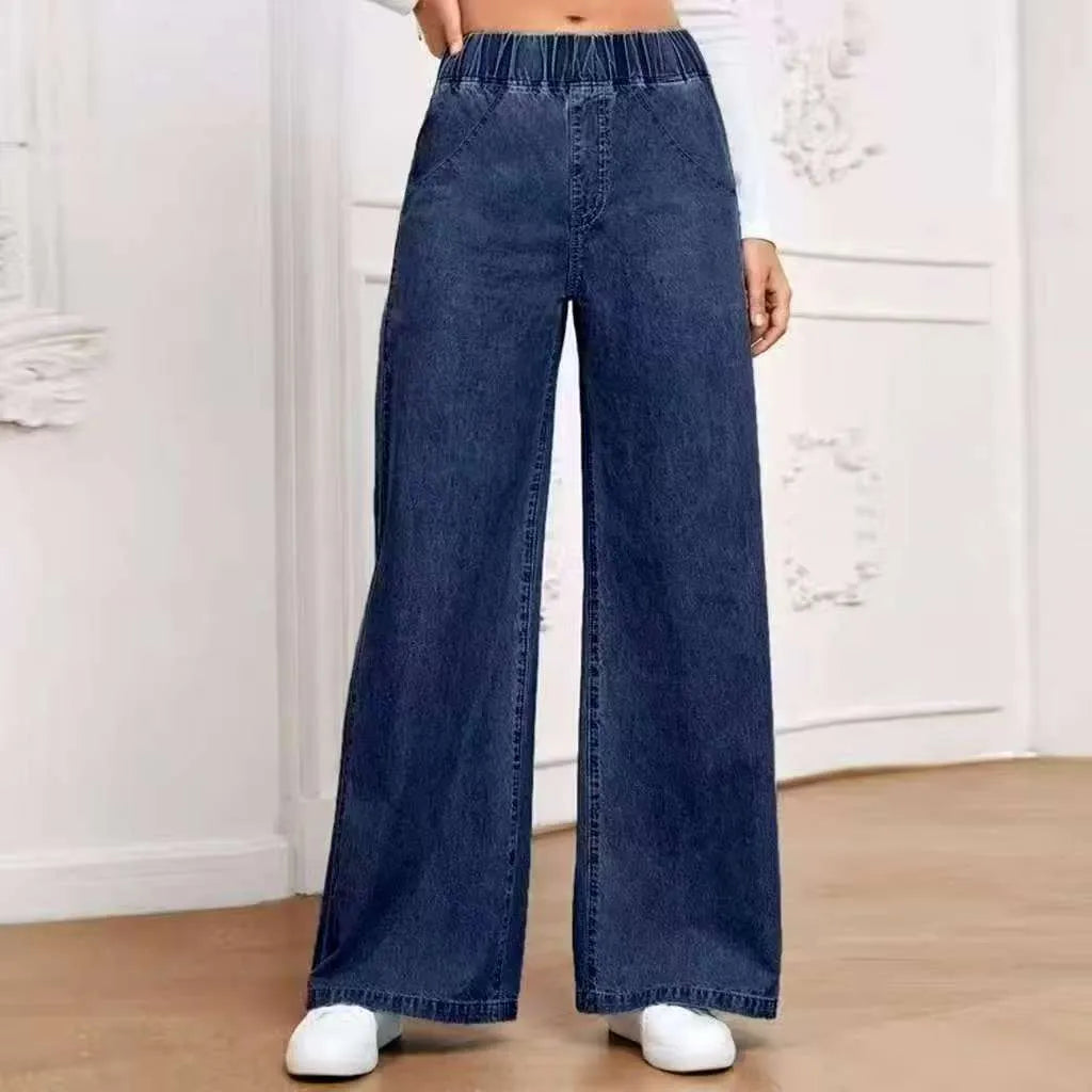 Light blue washed wide-leg denim trousers with straight cut and zip placket fly