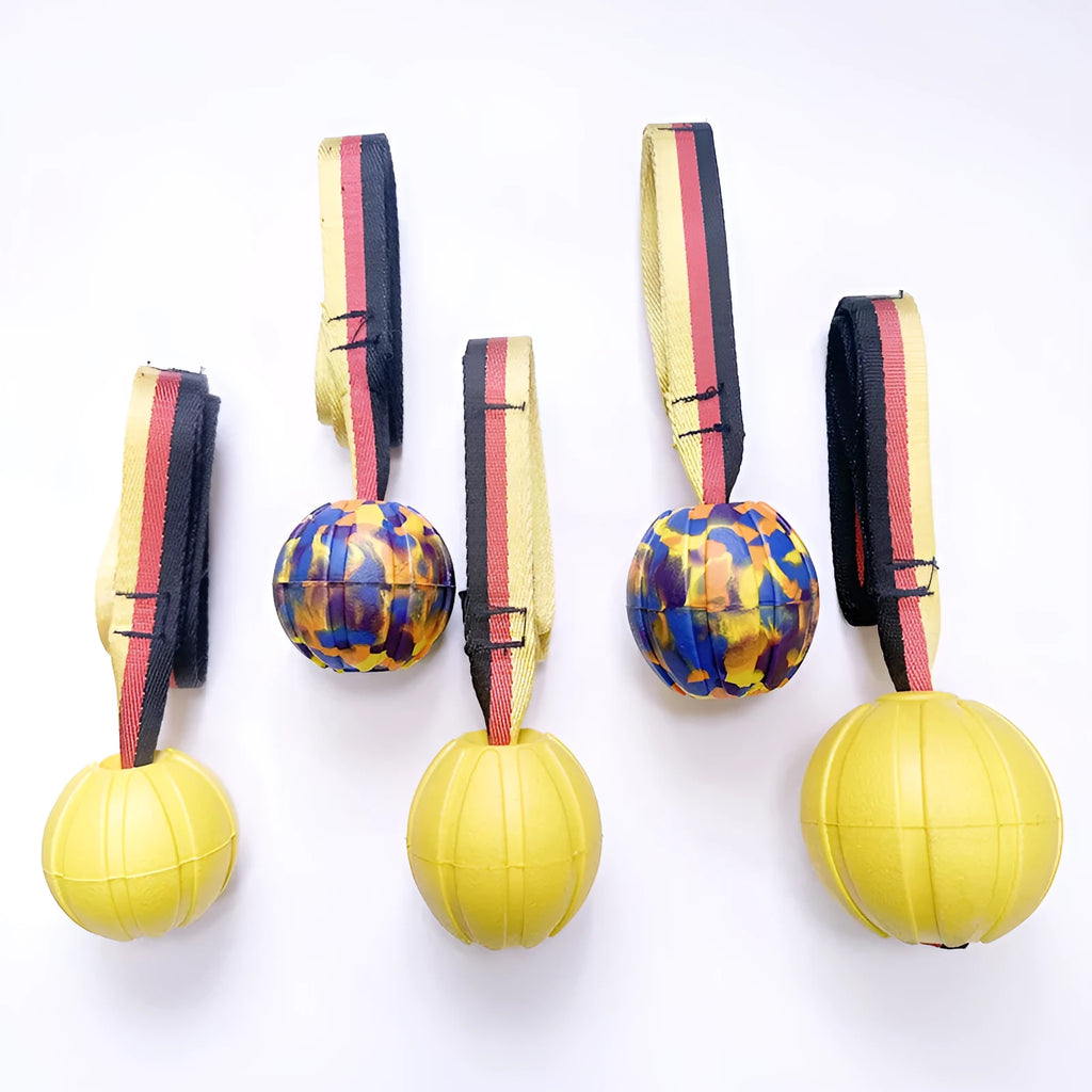 Floating water bite-resistant pet training ball in camouflage and yellow colours showing three size options
