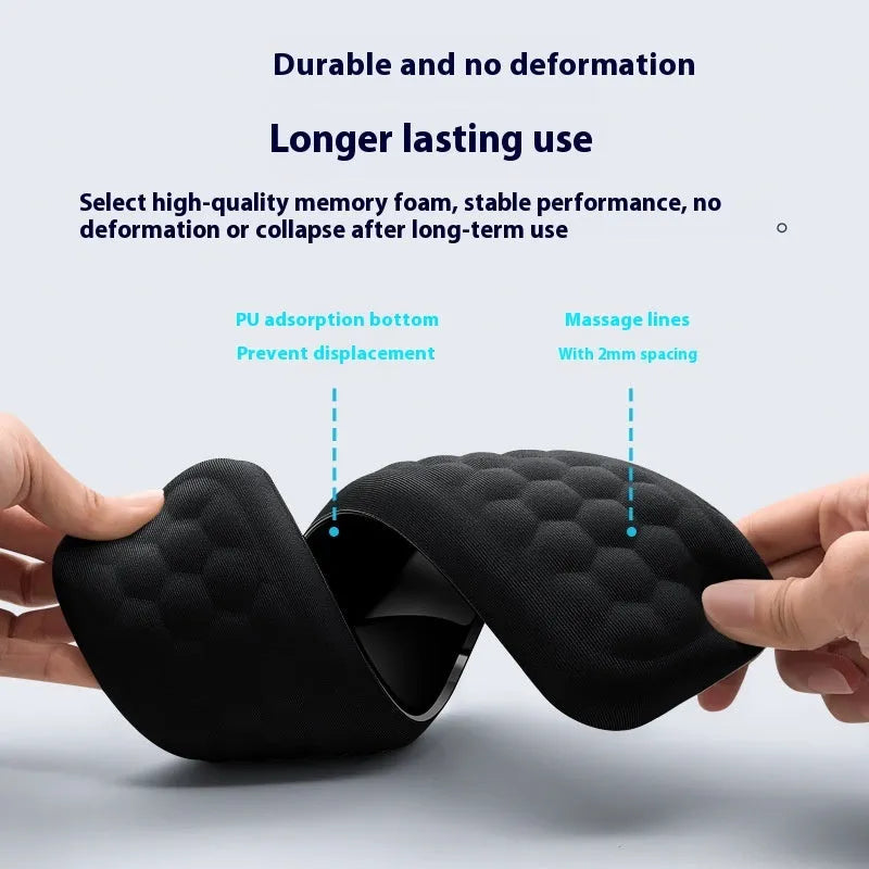 Memory foam mouse wrist pad with silicone bottom in black cloth cover on computer desk