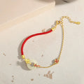 Women's gold electroplated 925 silver bracelet with red rope, koi and peace bucket charms, zodiac animal design