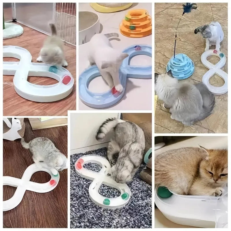 Blue and white cat turntable track ball toy with teasing stick attachment on flat surface