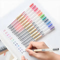 Pack of twelve Muji gel pens with clear barrels and 0.5mm fine black ink nibs