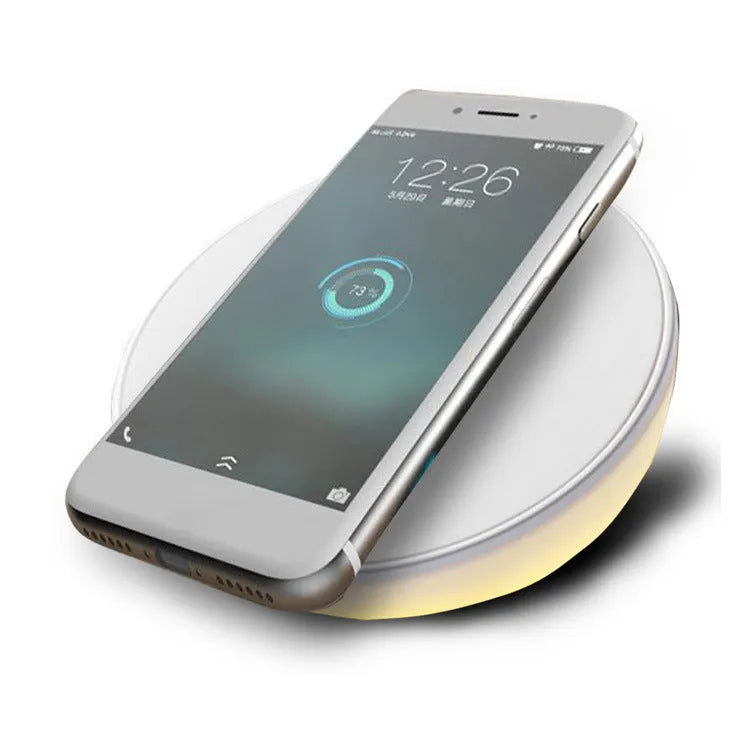 White wireless charging pad with digital clock display and three control buttons