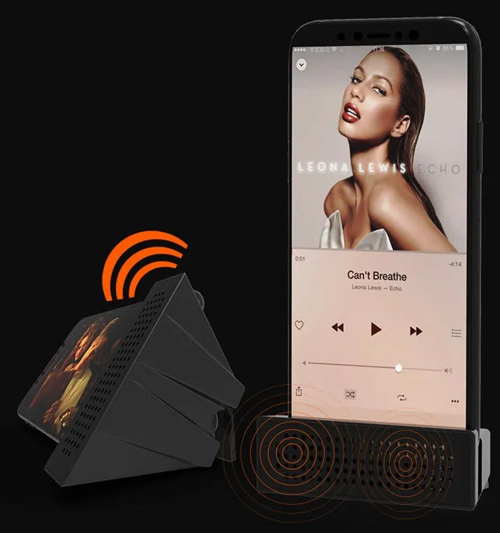 Mini black ABS plastic mobile phone amplifier bracket holding a smartphone on a desktop.