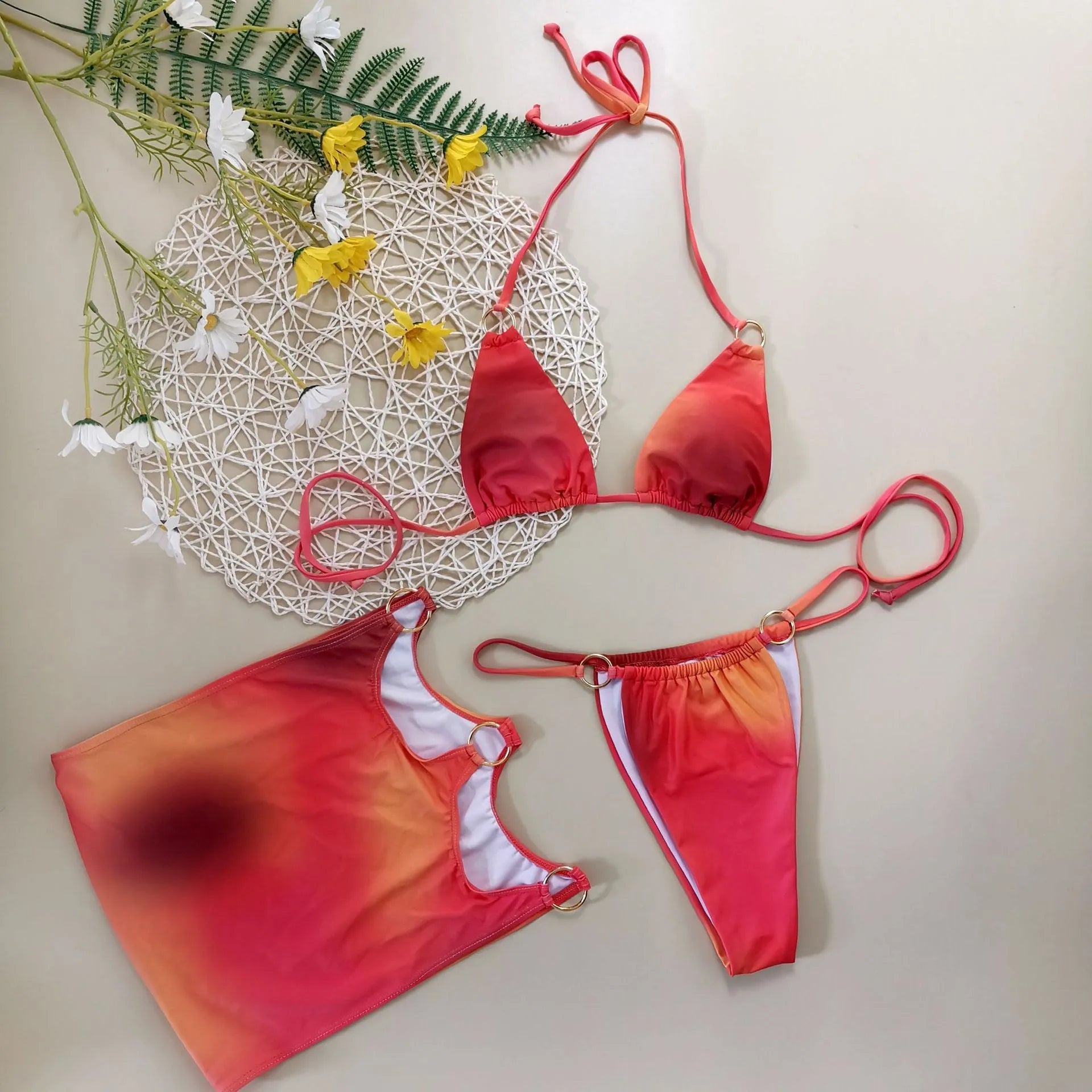 Tie-dye gradient three-piece halter bikini swimwear set on a mannequin