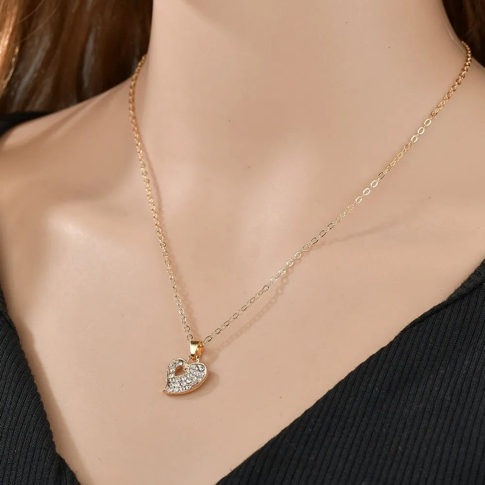 Women's gold-colour alloy jewellery set with heart, water drop and bell pendants including earrings and adjustable decorations