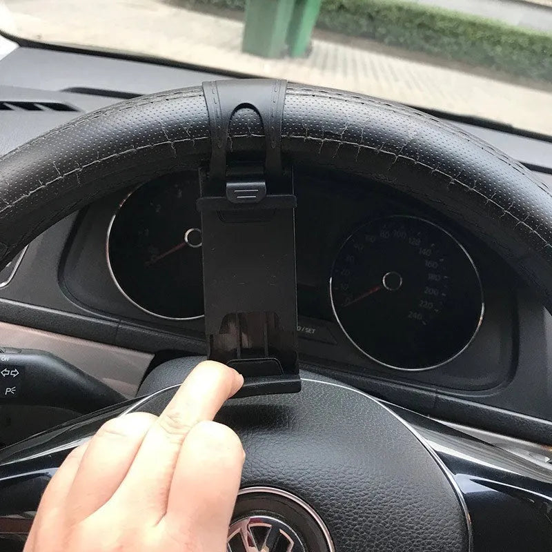 Black universal steering wheel phone holder clip for smartphones showing silicone pad
