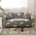 Geometric abstract print stretch sofa slipcover on a modern sofa